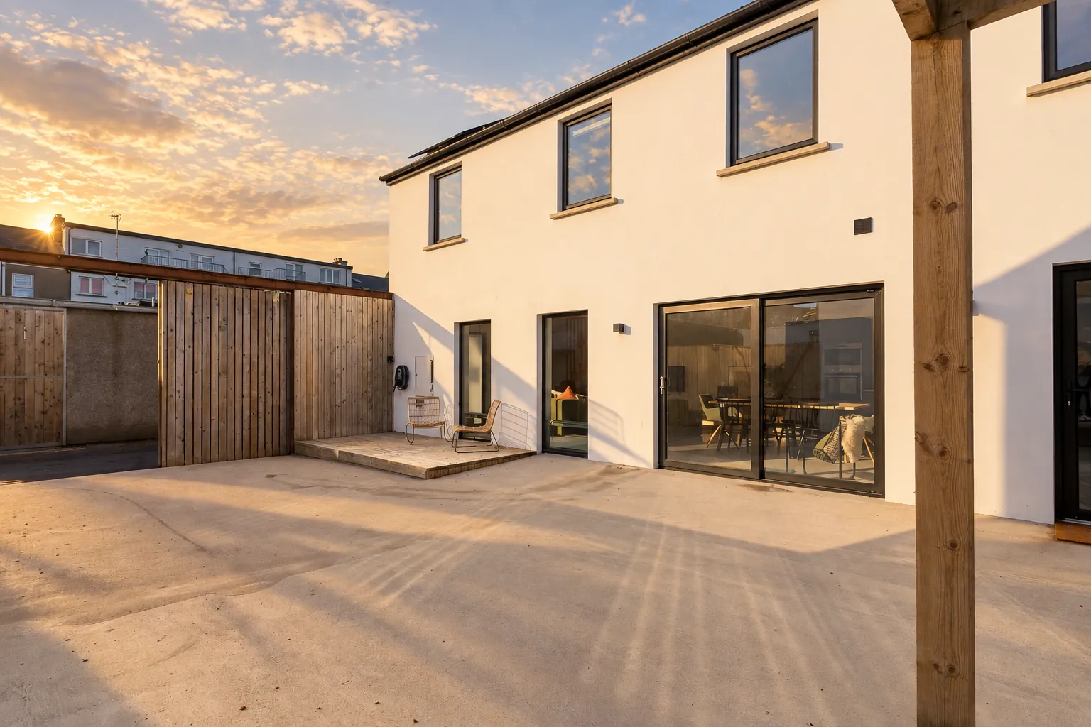 White rendered townhouse and courtyard at sunset, Northern Ireland